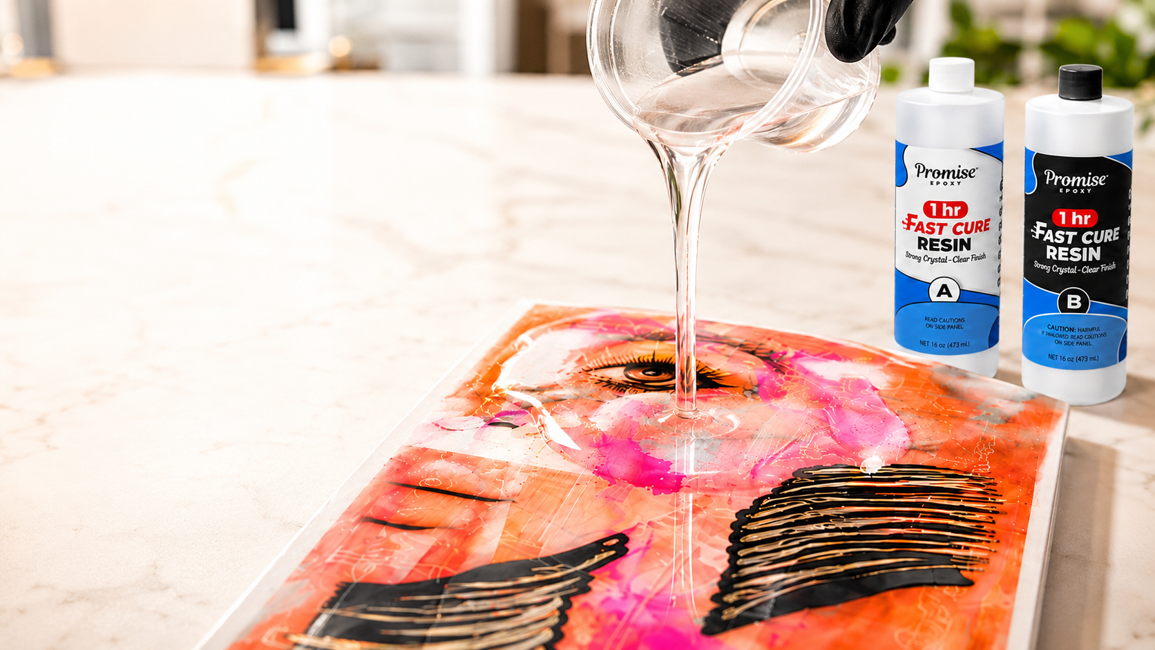 Clear epoxy resin being poured onto a colorful resin art project with Promise Epoxy 1 Hour Fast Cure Resin bottles in the background.